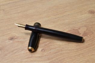 A Parker Vacumatic fountain pen in black with three narrow bands to the cap having Parker Duofold