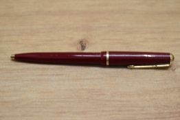 A Parker Jotter ballpoint pen in red with decorative band