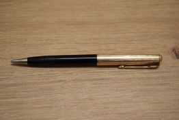 A Parker 51 propelling pencil in black with gold filled cap. Engraved