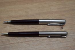 Two Parker propelling pencils in burgundy on with liquid lead cartridge