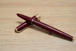 A Parker 17 Super aero fill fountain pen in burgundy with broad band to the base of the cap