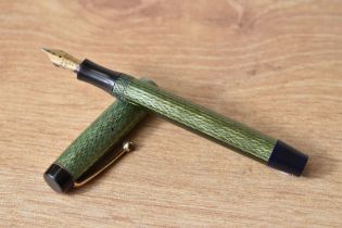 A Parker Duofold Junior button fill fountain pen in green herringbone with single band to the cap