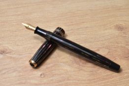 A Parker Duofold Geometric button fill fountain pen in in red, silver and black striated pattern