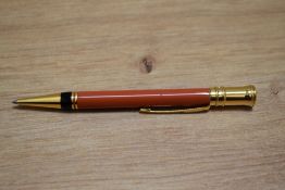 A modern Parker Duofold ballpoint pen in orange