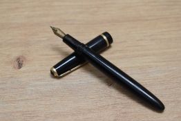 A Parker Slimfold aero fill fountain pen in black with a narrow decorative band to the cap having