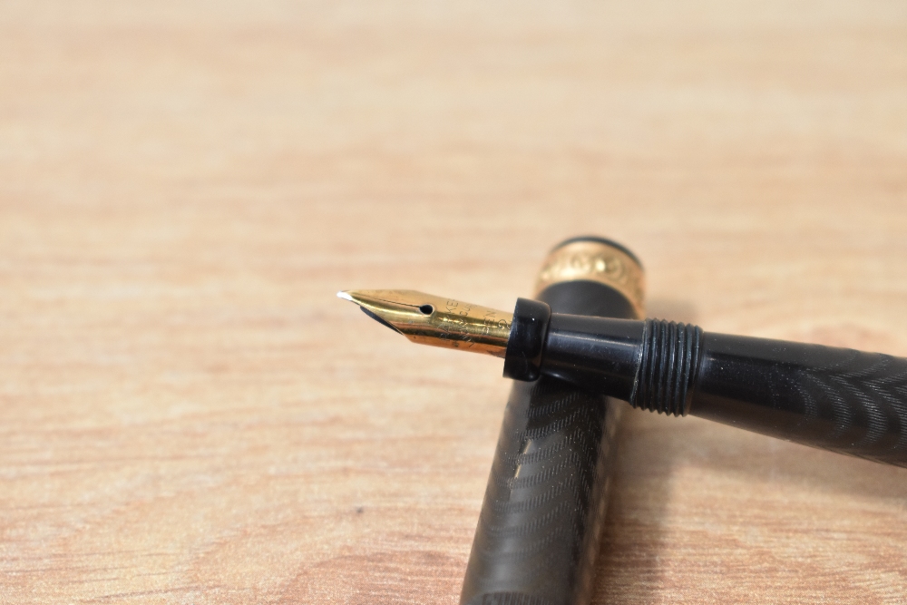 A Parker Lucky Curve button fill fountain pen in BHR with a decorative gold bands to the cap - Image 2 of 3