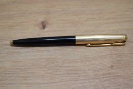 A Parker 51 ballpoint pen in black with gold fill cap. Boxed