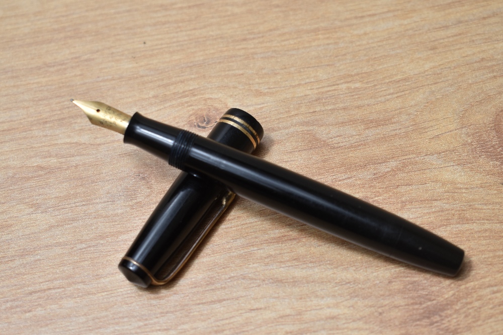 A Parker Victory button fill fountain pen in black with two bands to the cap having Parker 14k N