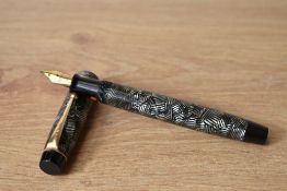 A Parker Victory button fill fountain pen in grey lined pattern with single band to the cap having