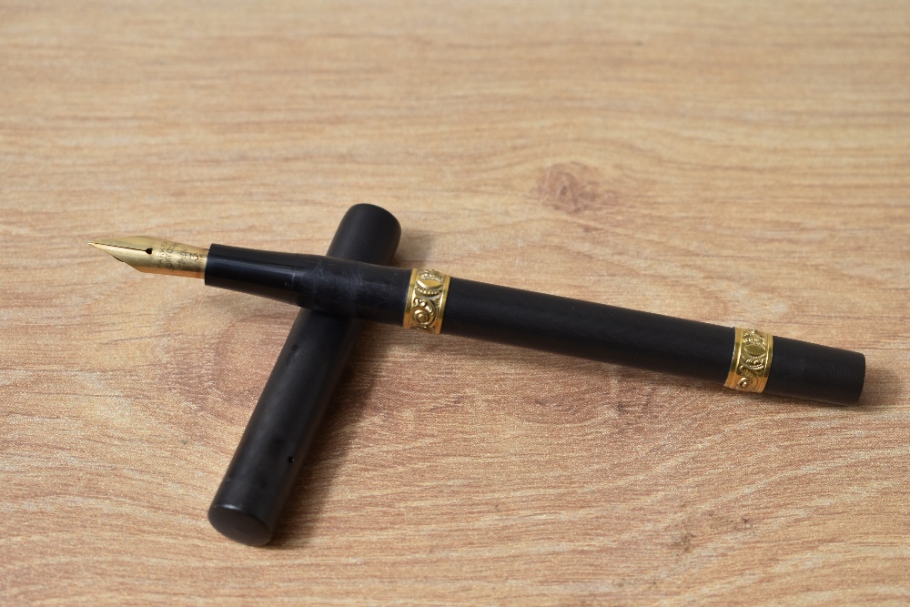 A Parker Lucky Curve Eyedropper fountain pen in BHR with two decorative gold bands to the barrel