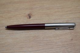 A Parker 51 ballpoint pen in burgundy and Lustraloy. Boxed