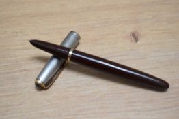 A Parker 51 vacumatic fill fountain pen in chocolate brown with sterling silver cap having blue