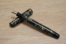 A Parker Televisor Junior button fill fountain pen in green marble with broad band to the cap having