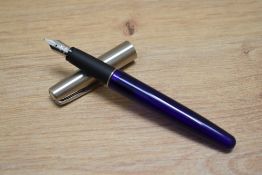 A Parker Frontier cartridge fountain pen in translucent blue with stainless steel cap and Parker