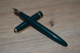 A Parker Slimfold aero fill fountain pen in green with narrow decorative band to the cap having