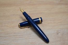 A Parker Duofold aerofill fountain pen in blue with decorative broad band to the cap the pen