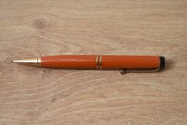 A Parker Duofold propelling pencil in red