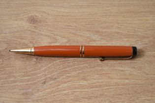 A Parker Duofold propelling pencil in red