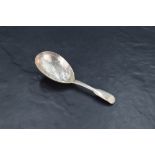 A Victorian silver fiddle pattern caddy spoon, the oval bowl with foliate bright-cut engraving,