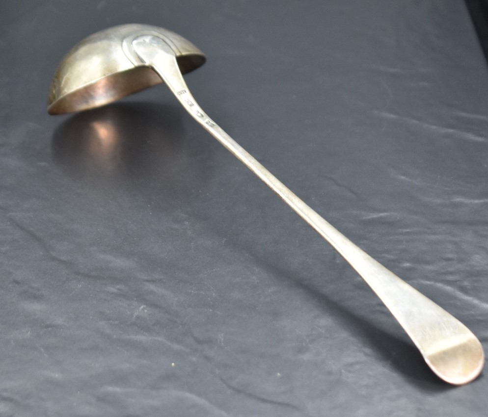 An early George III silver Hanoverian pattern ladle, the dished circular bowl issuing the long - Image 2 of 3