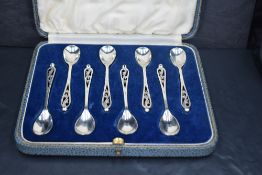 An attractive cased set of eight George VI silver coffee spoons, having ovoid bowls and foliate