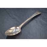 A George IV silver Old English Thread pattern serving spoon, engraved with crest 'A Dexter arm