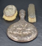A George V silver hand-mirror mount, of traditional form and embossed with cherubs and clouds,