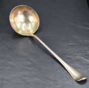 An early George III silver Hanoverian pattern ladle, the dished circular bowl issuing the long