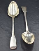 A pair of George III silver fiddle pattern serving spoons with engraved initial C to terminals,