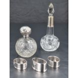 An Edwardian silver mounted and cut glass scent bottle, with facet-cut stopper and star-cut onion-