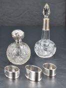 An Edwardian silver mounted and cut glass scent bottle, with facet-cut stopper and star-cut onion-