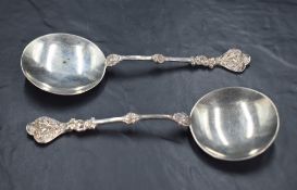 A pair of Edwardian silver trefoil spoons, of medieval design the the shallow circular bowls with