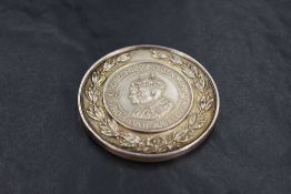 *Golfing interest, A George V and Queen Mary Jubilee silver sporting medal, 'The Silver Jubilee