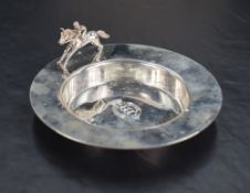 A Queen Elizabeth II silver dish, of circular form, the broad plain rim with racehorse ornament