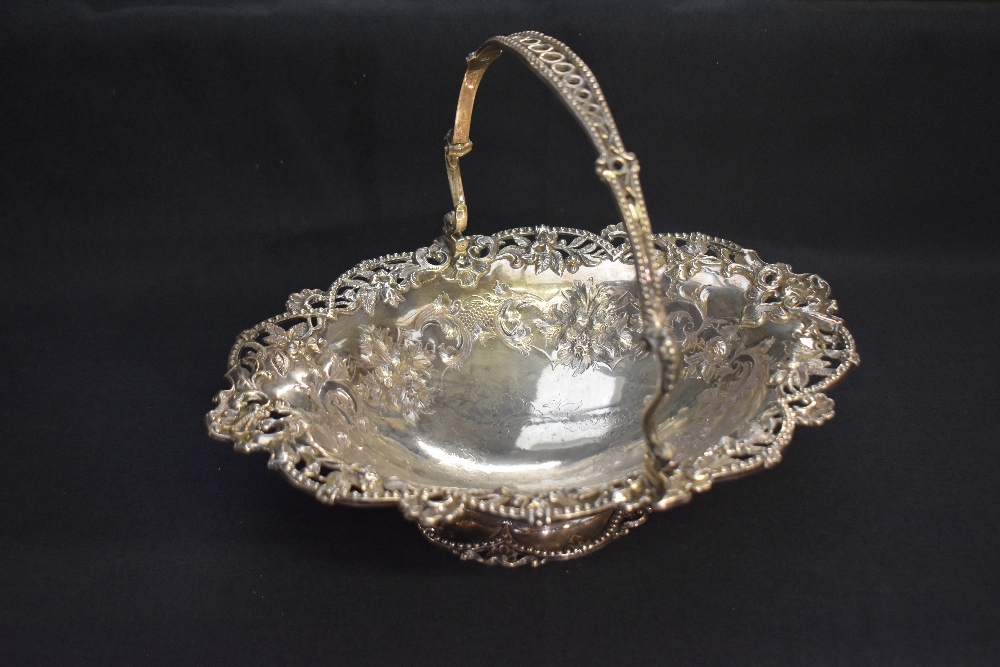 A Victorian silver basket, of oval form with pierced and bead-moulded pivoted handle, over the - Image 2 of 5