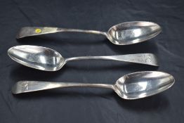 Three George II silver Old English pattern table spoons, the terminals engraved with crest 'A Dexter