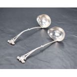 A pair of George V imported Danish Georg Jensen silver sauce ladles, with Georg Jensen mark,