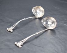 A pair of George V imported Danish Georg Jensen silver sauce ladles, with Georg Jensen mark,
