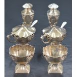 A George V silver six piece condiment set, comprising two salts, two pepperettes and two mustards,