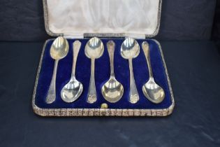 *Golfing interest, a cased set six of George V silver teaspoons, the trefoil surmounts with