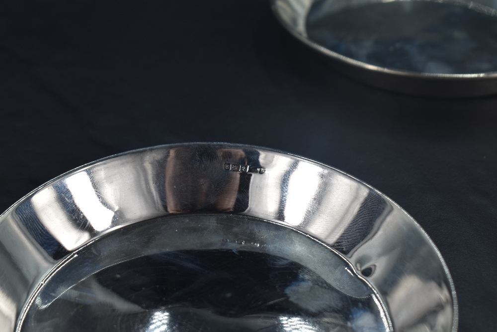 A pair of George V silver dishes or coasters, of circular form with angled booge and rolled rim, - Image 2 of 2