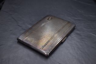 A George VI silver cigarette case, of hinged rectangular form engine-turned in bands with