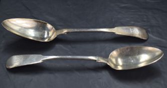 A George III silver fiddle pattern table spoon, with pointed oval bowl and couped dog head crest,