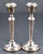 A pair of Queen Elizabeth II silver candlesticks, of classical design, marks for Birmingham 1975,