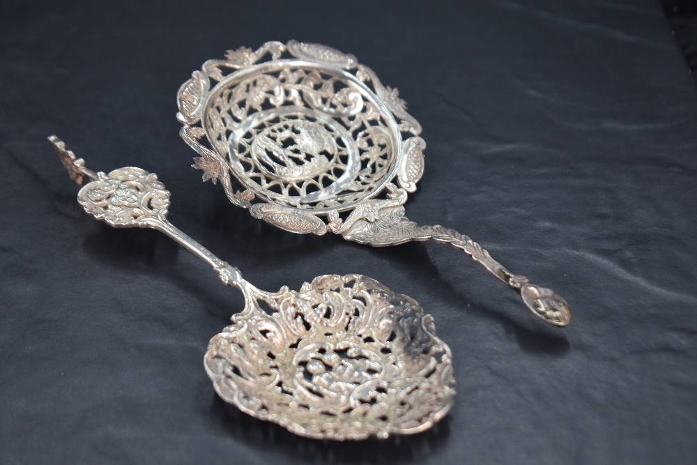 A late Victorian imported silver decorative straining spoon, pierced and engraved throughout, - Image 2 of 3