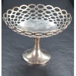 A George V silver pedestal dish, of dished circular form with repeating pierced oval design,