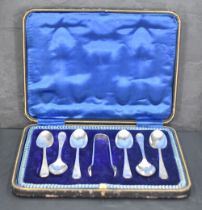 A cased set of six George V silver teaspoons and sugar tongs, engraved with foliate detail, marks