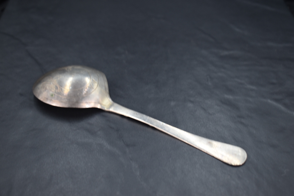 An unusual 17th/18th century Scandinavian white metal spoon, the shallow circular bowl issuing a - Image 2 of 3