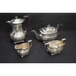 A George V silver four-piece tea set, comprising hot water pot, teapot, sugar and cream, each of