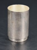A Queen Elizabeth II silver beaker, of planished cylindrical form with short circular foot, marks